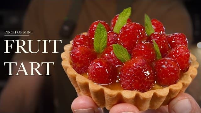 Fresh fruit tarts, a still from its video, with the channel name and the recipe title in text across it