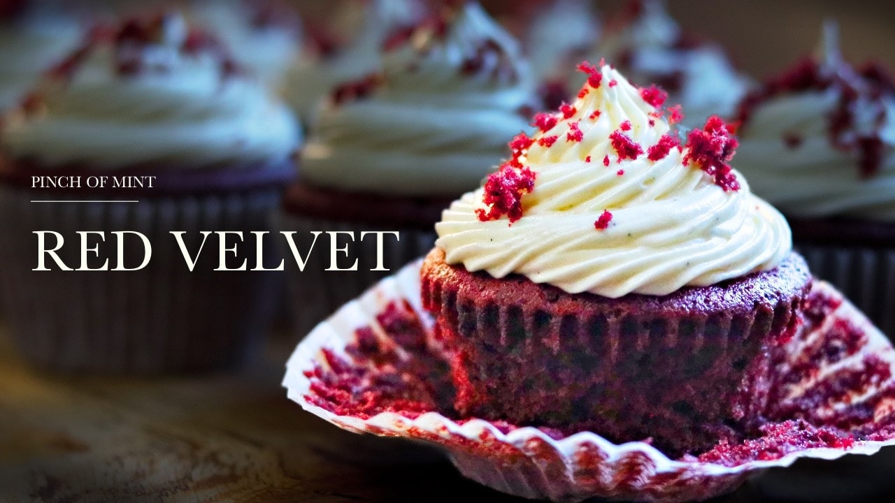 Red velvet cupcakes, a still from its video, with the channel name and the recipe title in text across it