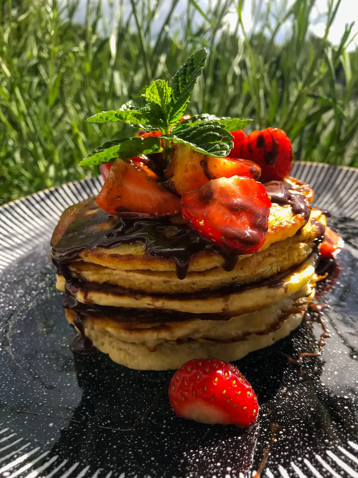 Oat pancakes with chocolate syrup, photographed for Pinch of Mint
