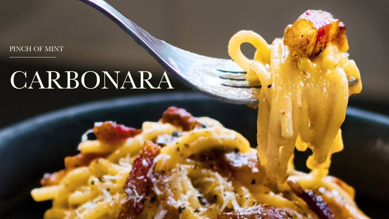 Carbonara, no cream, a still from its video, with the channel name and the recipe title in text across it