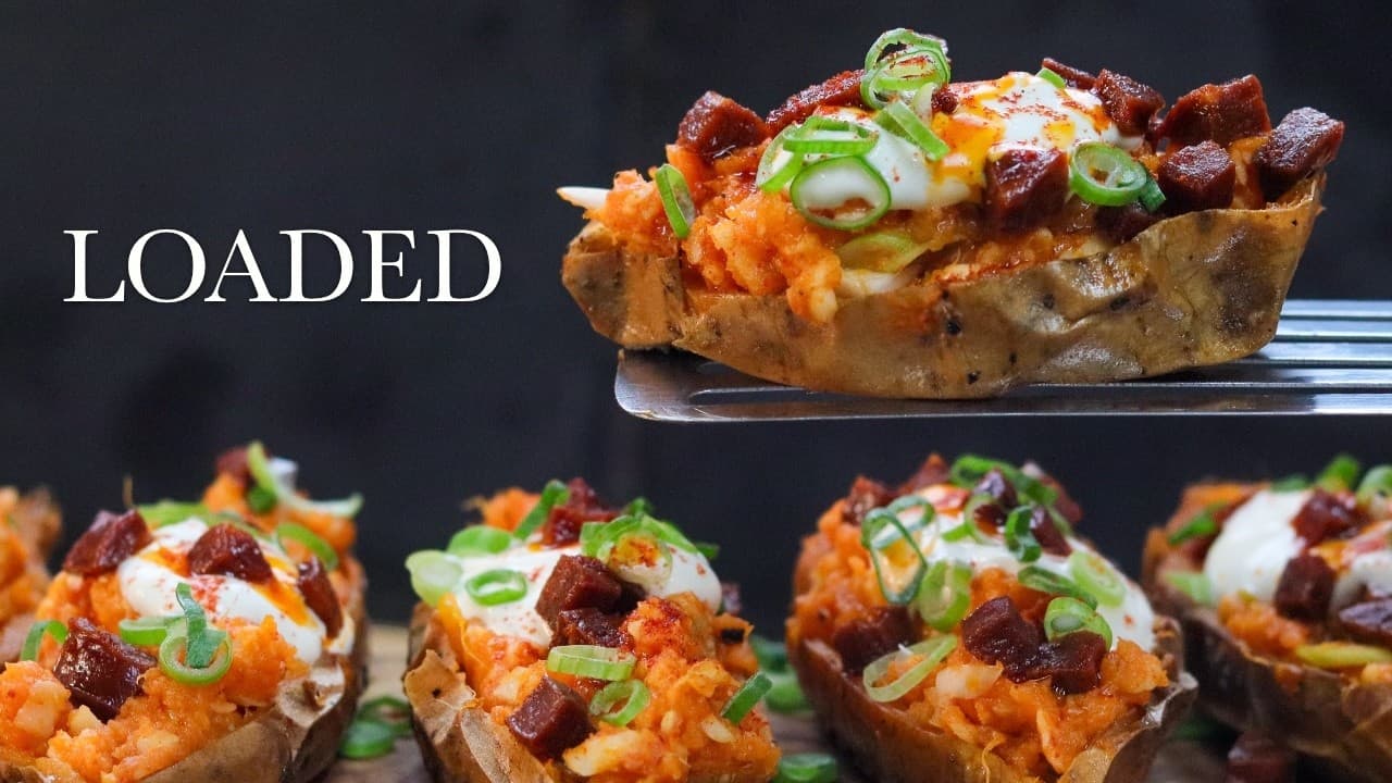 Loaded sweet potatoes with chorizo and Cheddar, a still from its video, with the channel name and the recipe title in text across it