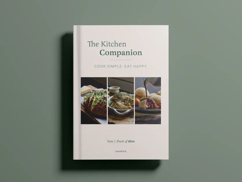 The Kitchen Companion by Tom, Pinch of Mint: the cover, with garlic bread, roast chicken and profiteroles